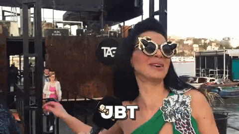 a woman wearing sunglasses and a green dress says jbt in a speech bubble