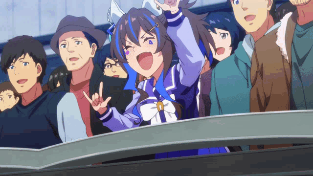 a group of people are watching a race and one of them is wearing a blue and white dress