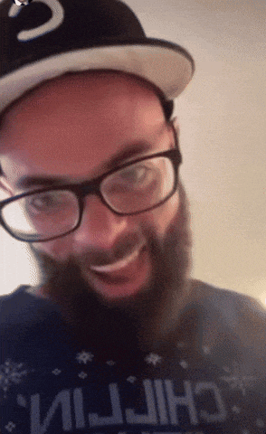 a man with glasses and a beard is wearing a shirt that says " chiptin "