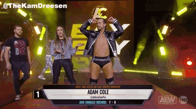 a wrestler named adam cole is standing in the ring