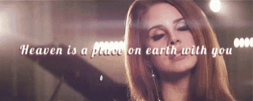 a close up of a woman 's face with the words `` heaven is a place on earth with you '' written above her .