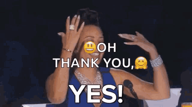 a woman is sitting in front of a microphone and saying `` thank you , yes ! ''