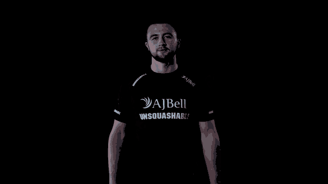 a man wearing a black shirt that says aibell