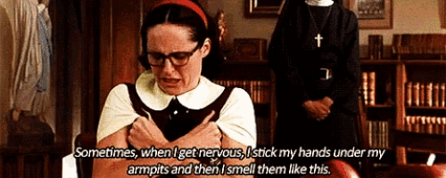 a woman with glasses says sometimes when i get nervous i stick my hands under my armpits