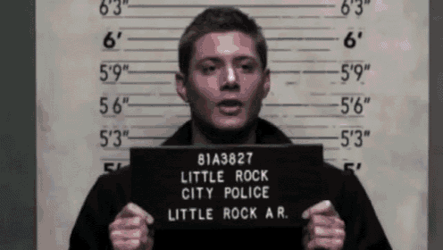 a man holds up a little rock city police photo