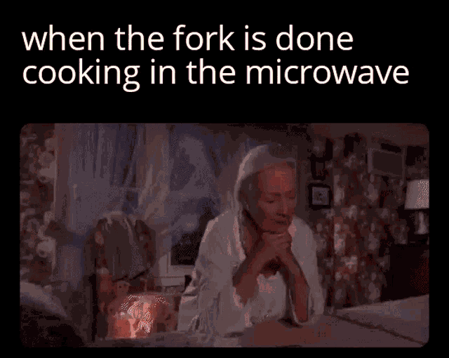 a woman is sitting on a bed with the words when the fork is done cooking in the microwave