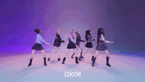 a group of young women are dancing in front of a studio choom logo