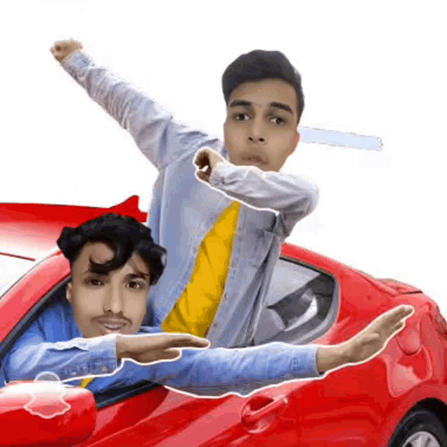 a man is sitting in a red car with his arm outstretched