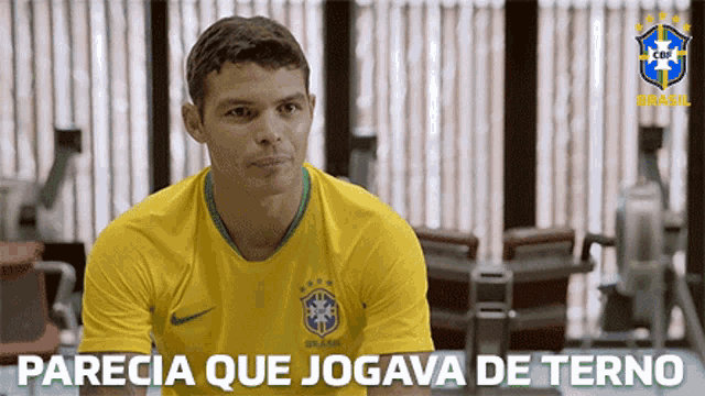 a man wearing a yellow shirt that says brasil