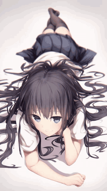 a girl with long black hair is laying on her back