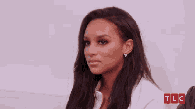 a woman is crying with a tlc logo in the corner