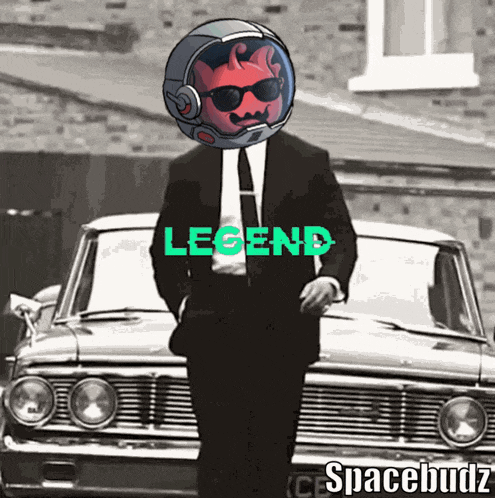 a man in a suit and helmet is standing in front of a car that says legend on it