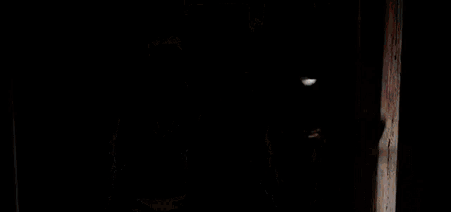 a boy and a girl are standing in a doorway .