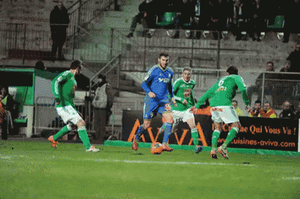 a group of soccer players are playing on a field with a sign that says cuisines-aviva.com