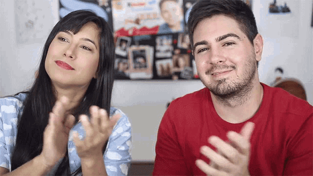 a man and woman are clapping their hands together