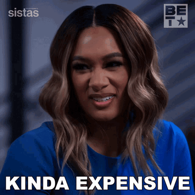 a woman in a blue shirt with kinda expensive written in the corner