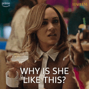 a woman is holding a martini glass and saying why is she like this