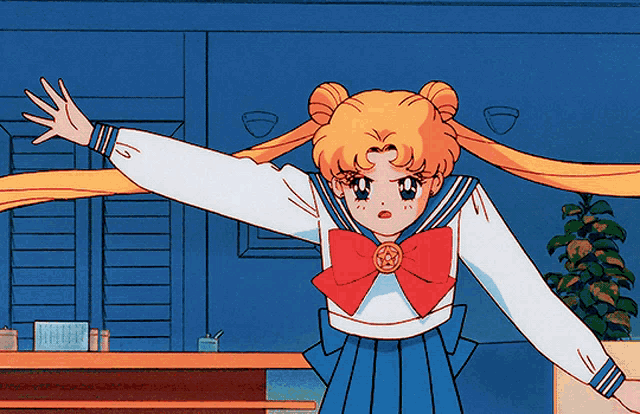 a girl in a sailor suit with a red bow on her shirt