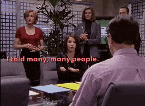 a group of people sitting around a table with the words " i told many many people " on the bottom