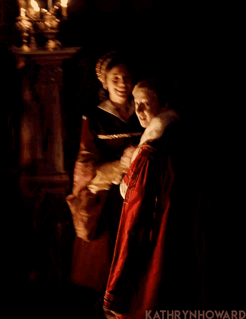 a man and a woman standing next to each other with the name kathryn howard on the bottom left