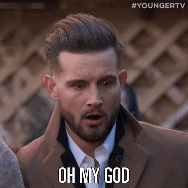 a man with a beard says oh my god on his face