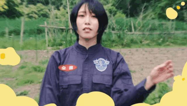 a woman in a blue uniform has a badge on her chest that says ' tokyo ' on it