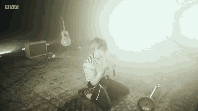 a person is kneeling down in front of a yamaha drum