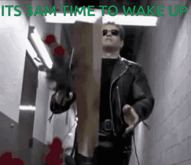 a man in a leather jacket is standing in a hallway with the words " its 3am time to wake up " on the bottom