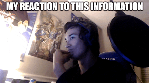 a man wearing headphones is looking at something with the caption my reaction to this information