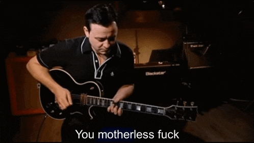 a man playing a guitar with the words " you motherless fuck " on the bottom