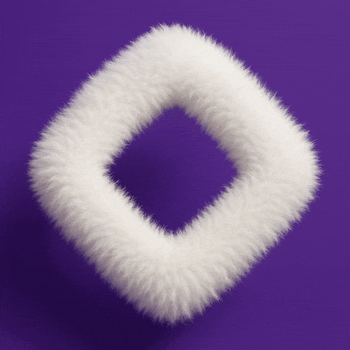 a white furry square on a purple surface