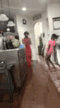 a blurry picture of a group of people standing in a room .