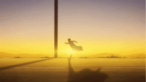 a silhouette of a person running in front of the sun