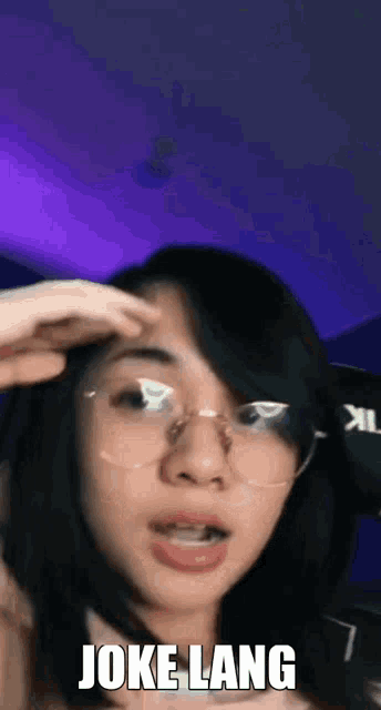 a woman wearing glasses is making a funny face and the words joke lang are on the bottom