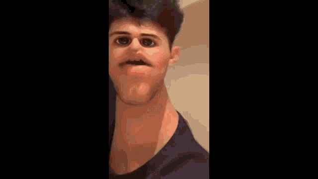 a man with a very long neck is making a face .