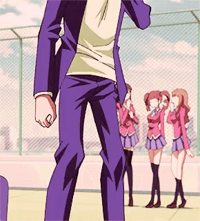 a man in a purple suit stands in front of two girls