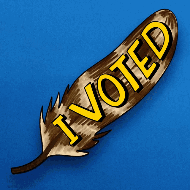 a brown feather with the words i voted written on it