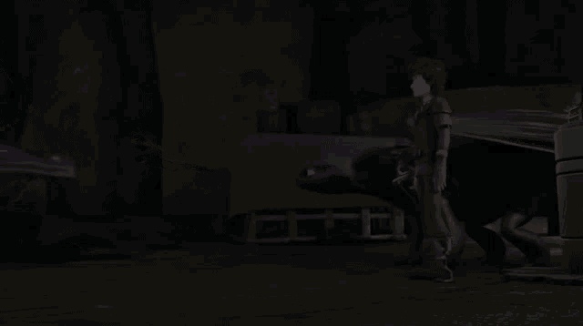 a man standing next to a dragon in a dark room
