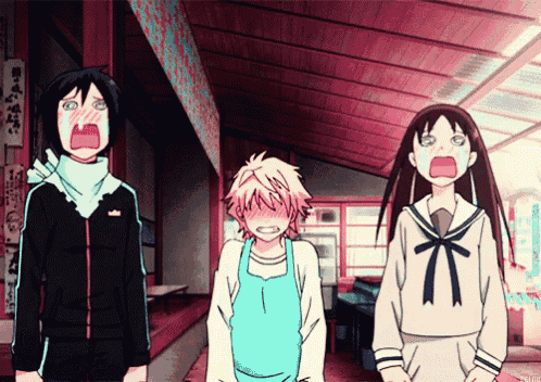 a group of anime characters are standing in a hallway with one girl making a funny face