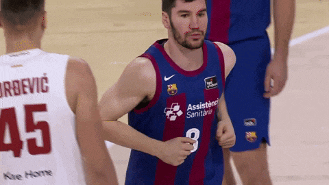 a basketball player wearing a number 8 jersey is running on the court