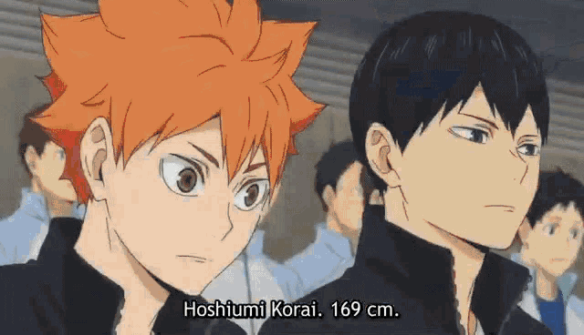 a couple of anime characters are standing next to each other and one of them is taller than the other .