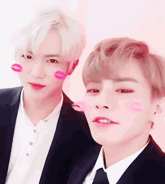 two men with pink lips on their faces