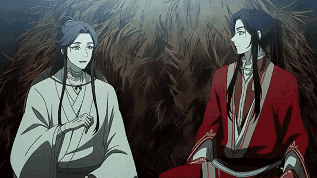 two anime characters are sitting next to each other in a room .