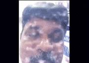 a close up of a man 's face with a beard covered in foam