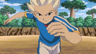 a cartoon character in a blue shirt and white shorts is standing on a field with trees in the background .