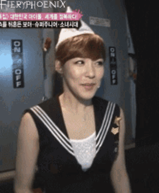 a woman in a sailor outfit is standing in front of a sign that says on and off