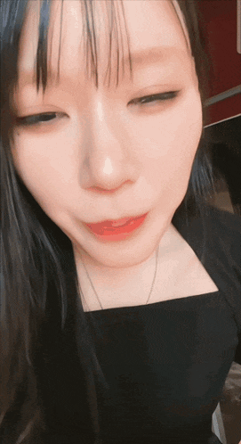 a close up of a woman 's face with red lips