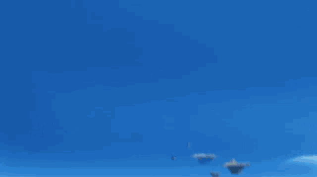 a blurry picture of a landscape with a blue sky