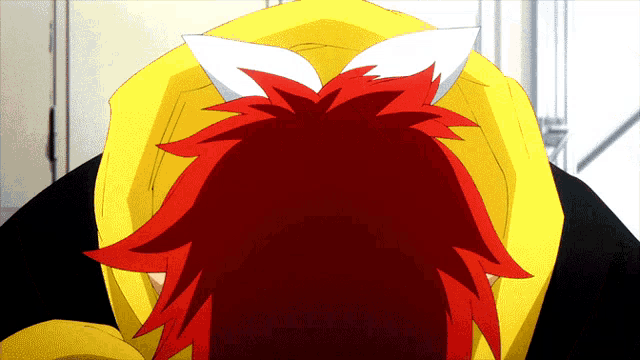 a close up of a person 's head with red hair
