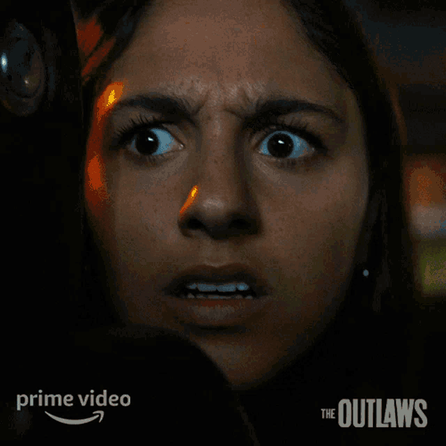 a poster for the outlaws with a woman 's face and the words " it 's the police "